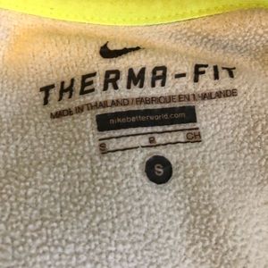 Nike zip up jacket with writing in the arm